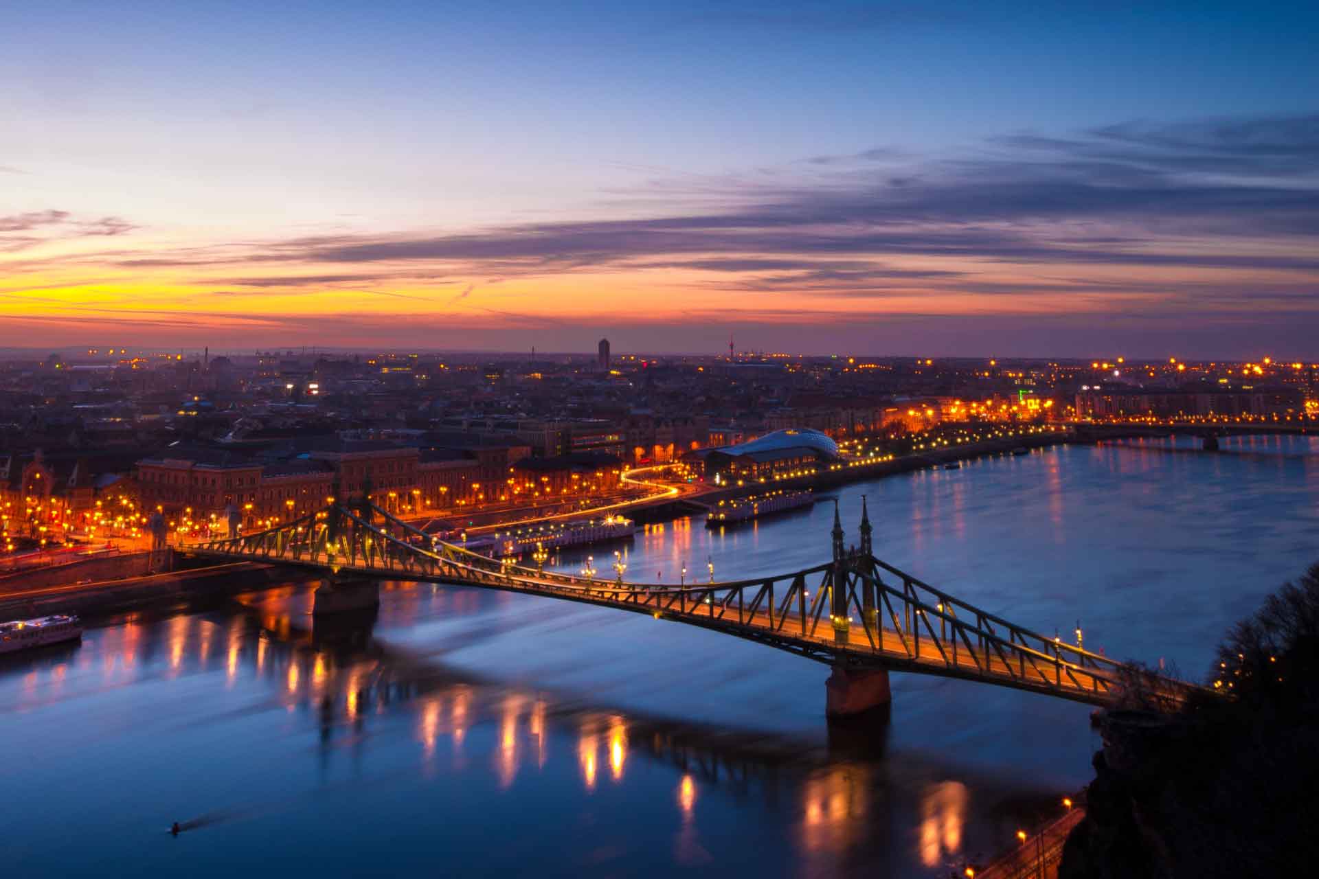 Tourists enjoying a daytime sightseeing boat cruise on the Danube River in Budapest