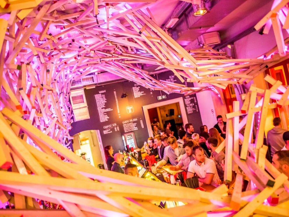 The massive branches of a 300-year-old tree shading the inner courtyard of Doboz