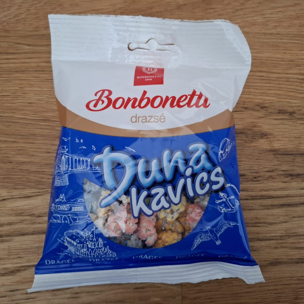 A pile of Dunakavics (Danube Pebbles) peanut dragee candies in bright pastel colors