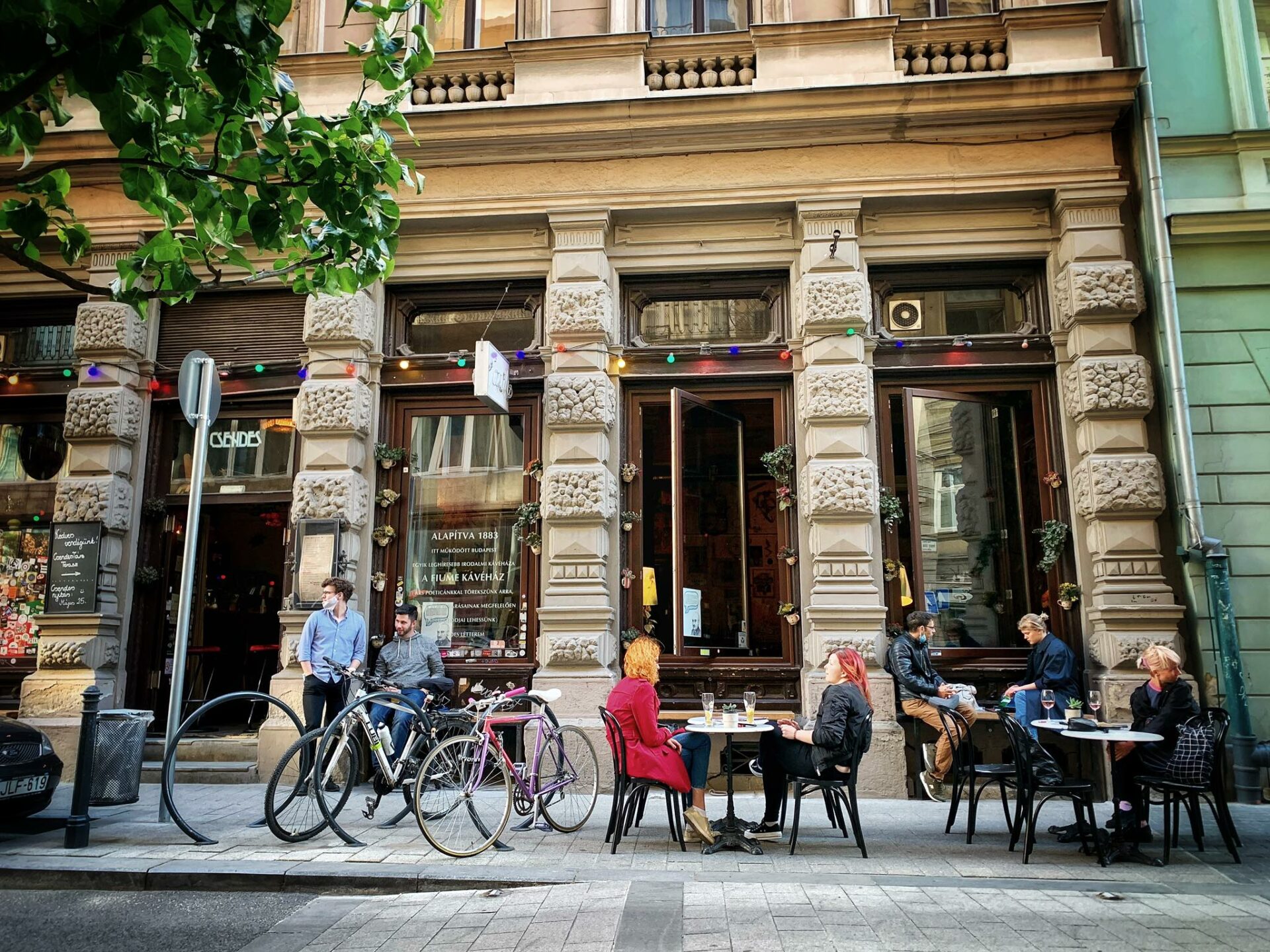 Strange, chaotic trash-art and thrift store decorations on the walls of Csendes
