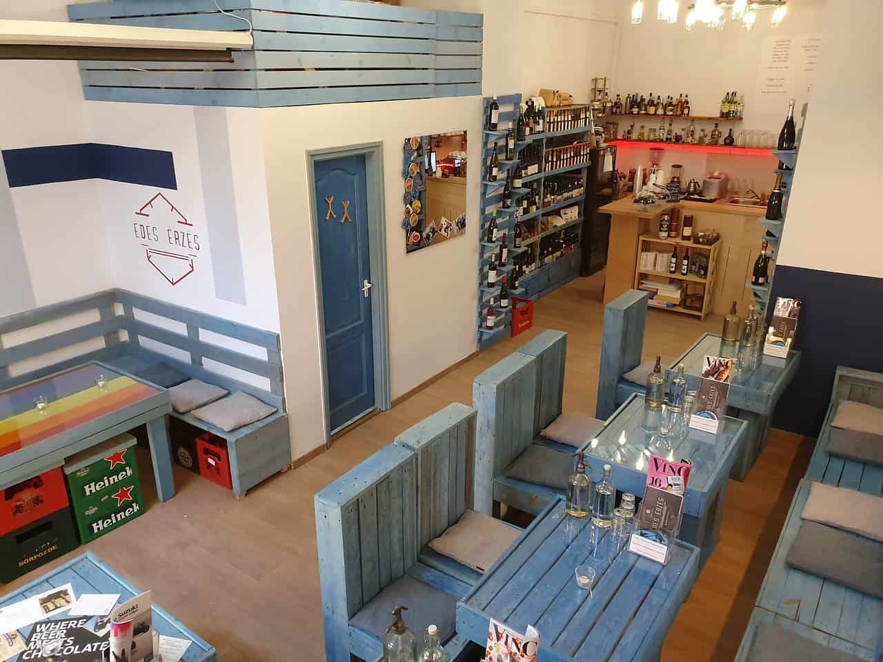 The colorful, eclectic interior of the Édes Érzés cafe showcasing vintage furniture