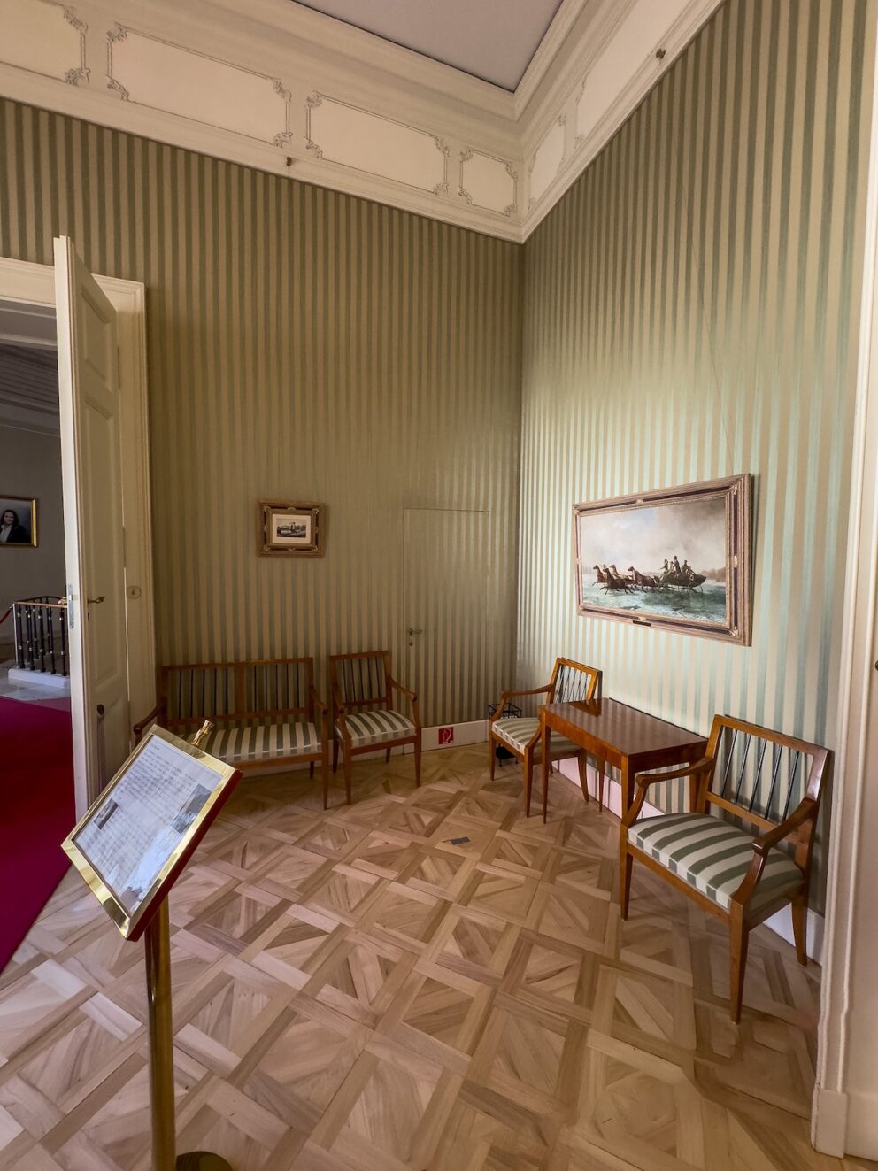 The yellow and mahogany Empire Salon inside the palace