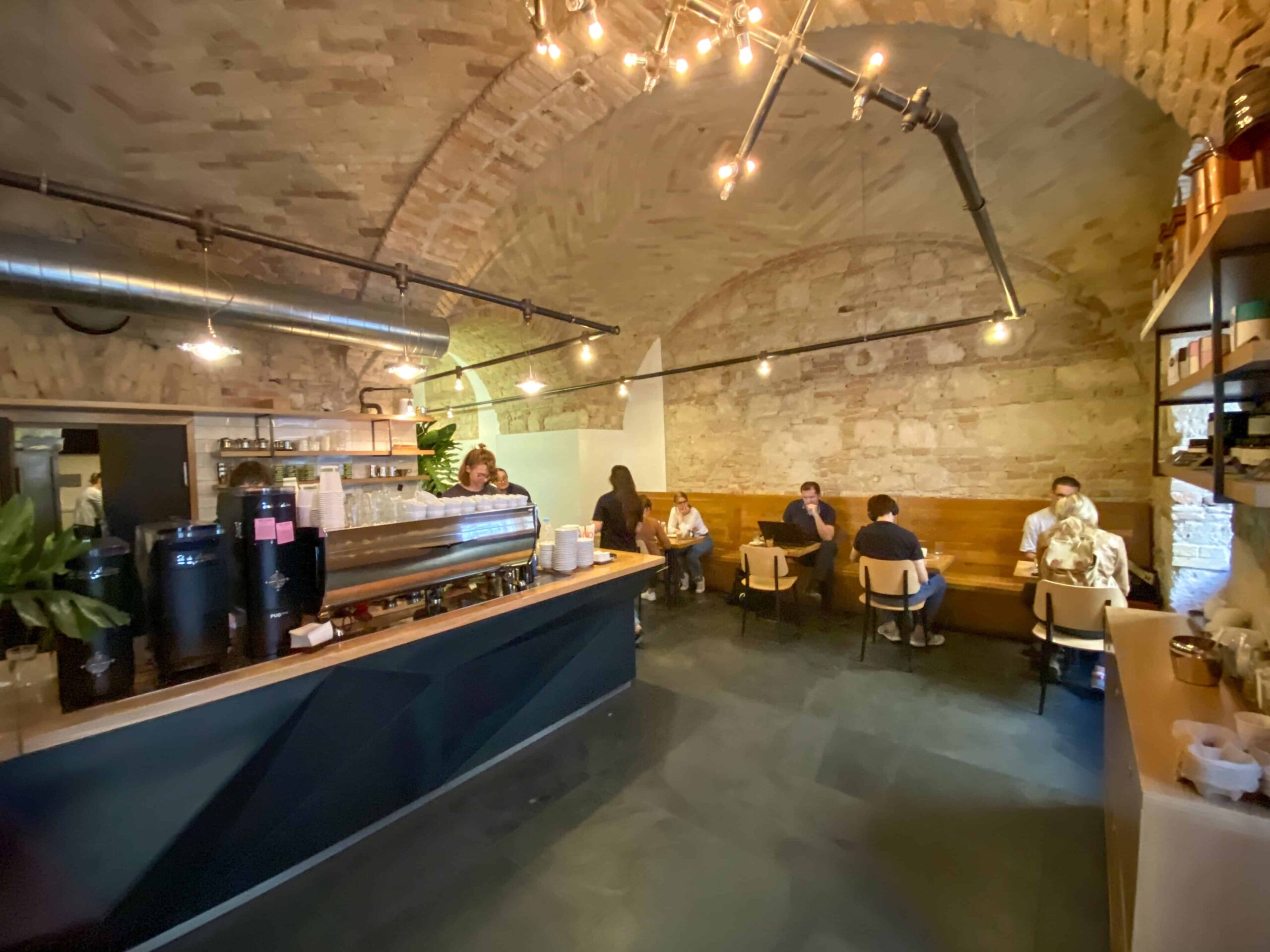 The atmospheric vaulted brick interior of Espresso Embassy coffee shop