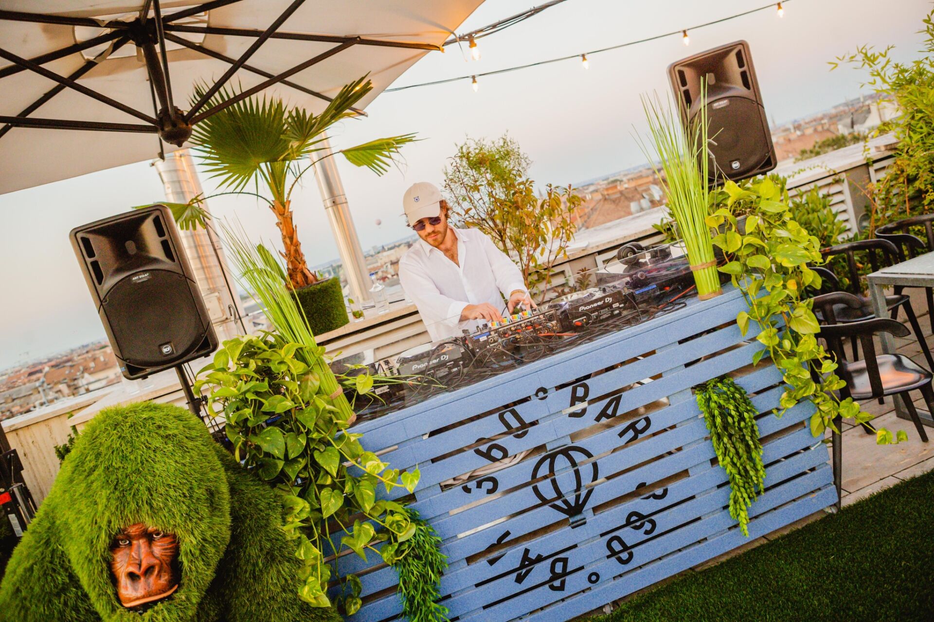 The industrial interior and neon sign of FIRST Craft Beer Bar in Budapest