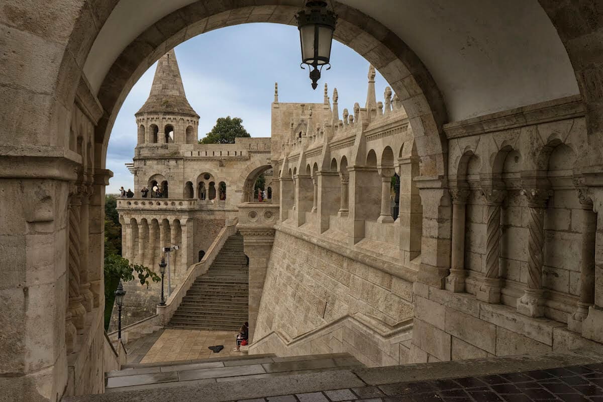 The grand ceremonial stone stairs leading up through a massive carved arch at the Bastion