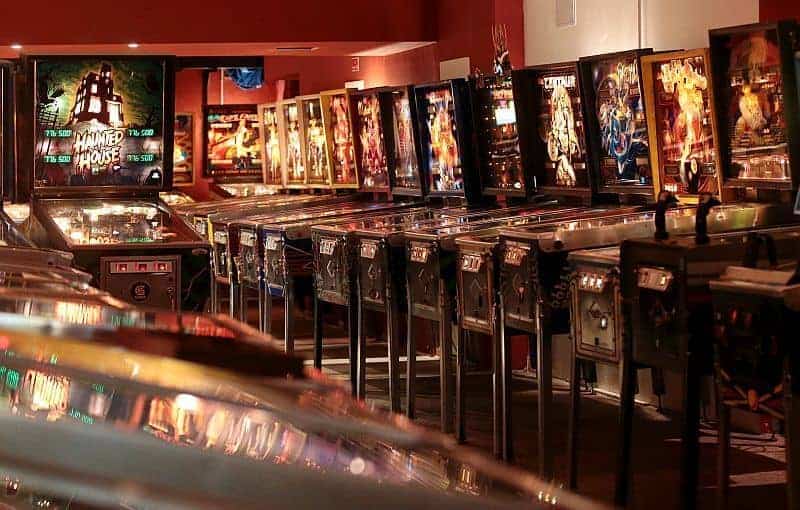The vibrant neon-lit rows of vintage machines at the Budapest Pinball Museum