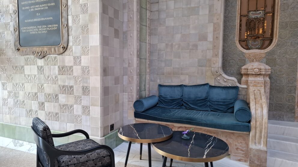 The calm, pristine blue infinity lap pool inside the luxury top-floor hotel spa