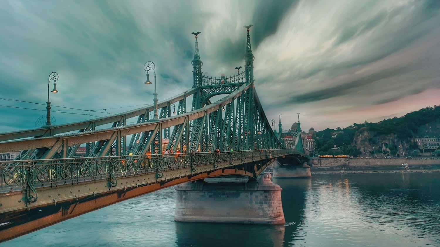 Liberty Bridge gracefully spanning the calm Danube linking the Pest and Buda sides