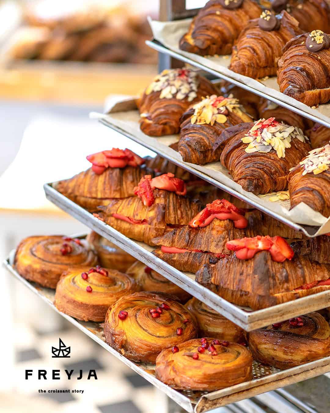 A golden heap of perfectly layered croissants at Freyja