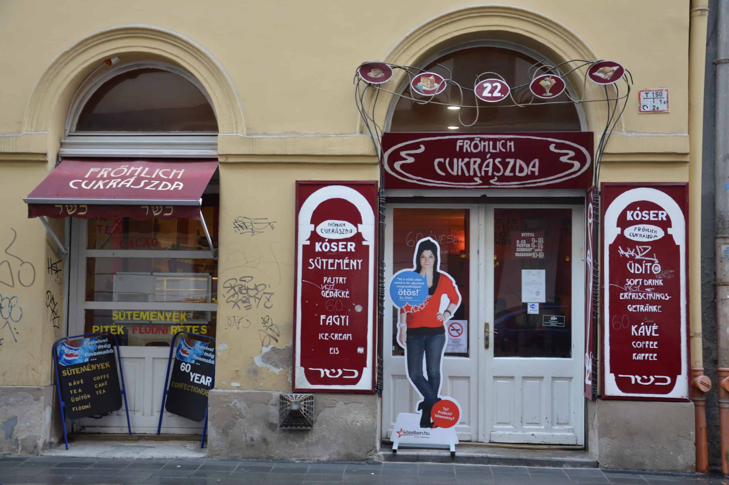 The vintage storefront of the Frohlich Kosher Bakery on Dob Street