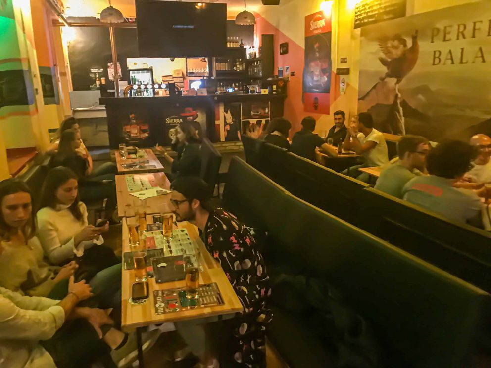 The eclectic interior of the ruin bar featuring crumbling plaster walls and colorful graffiti