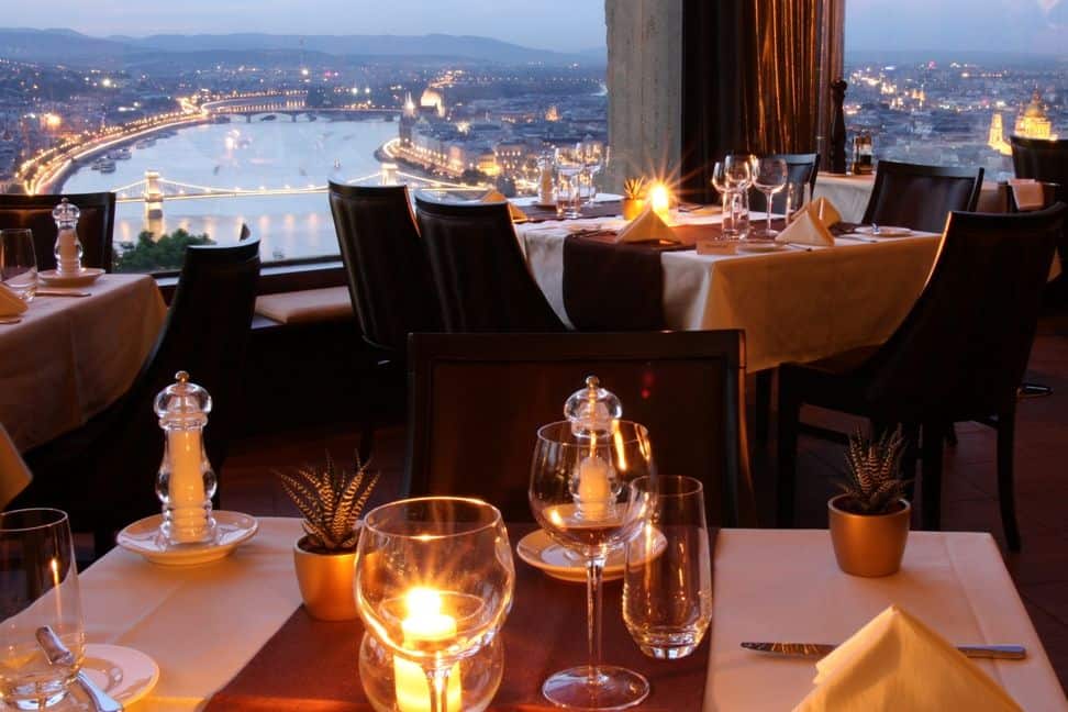 The rocky slopes of Gellért Hill topped by the iconic Liberty Statue beside the river