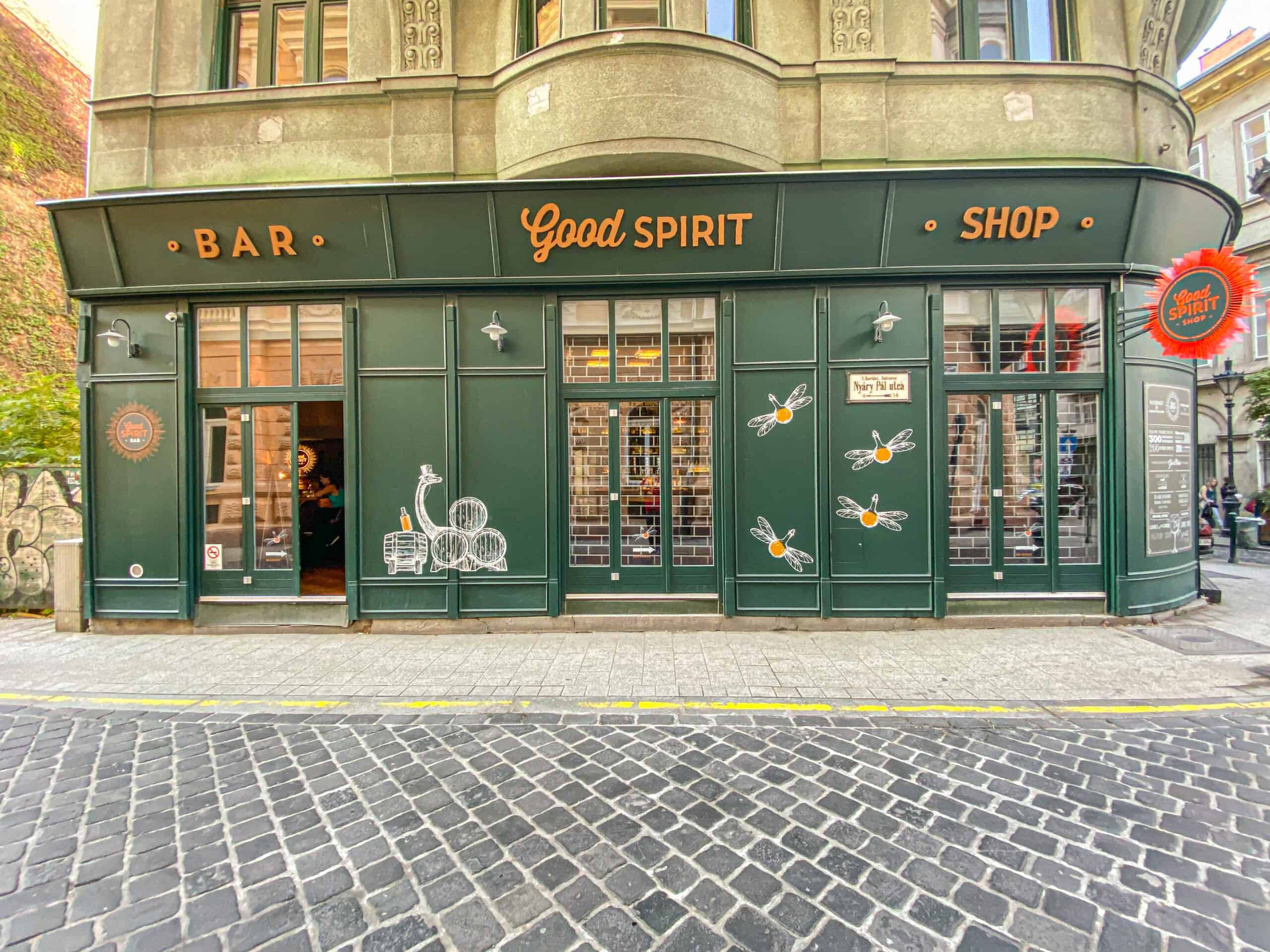 The clean, modern glass exterior of the GoodSpirit Bar in downtown Budapest