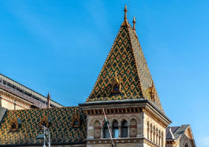 The vibrant, multi-colored Zsolnay ceramic tiles on the roof of the Market Hall