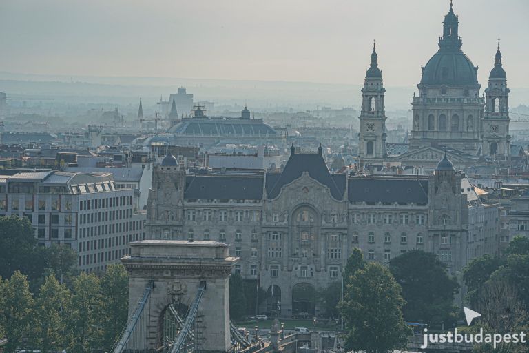 Aerial perspective of the Gresham Palace and St. Stephen's Basilica in the background, next to the Chain Bridge.