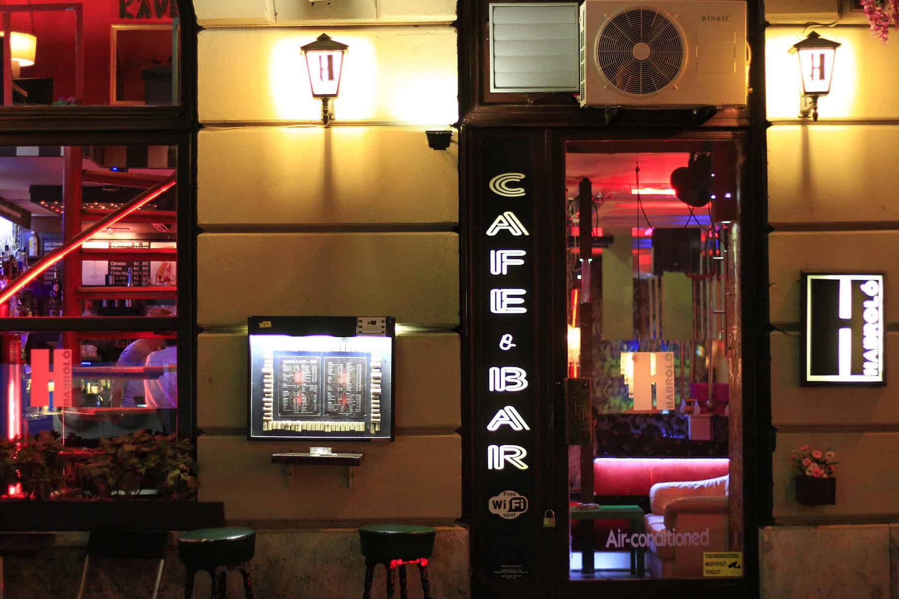 The small, dimly lit wooden interior of the historic Habroló Bisztró