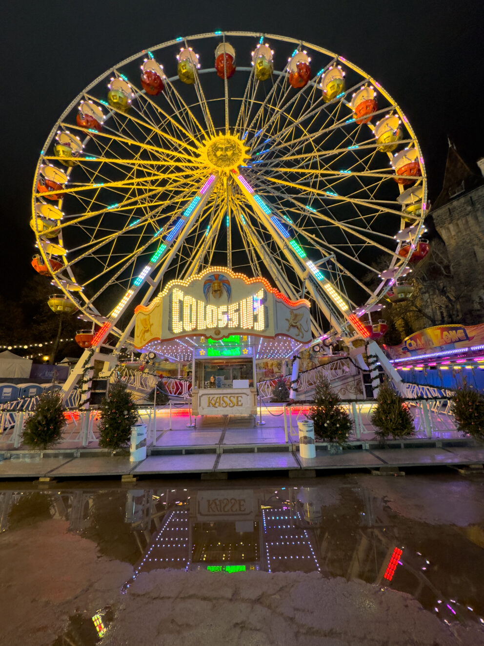 The brightly painted gondolas of the miniature Family Ferris Wheel