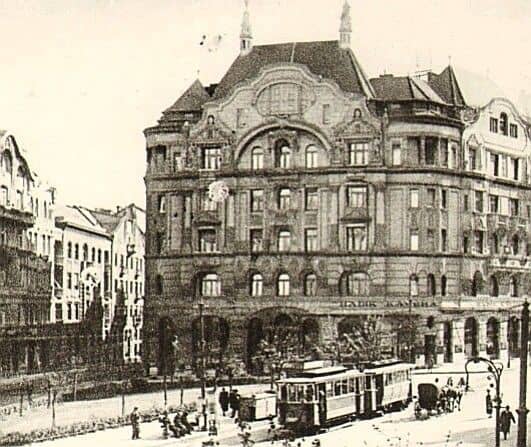 A vintage sepia photograph of the grand building housing the Hadik Coffeehouse
