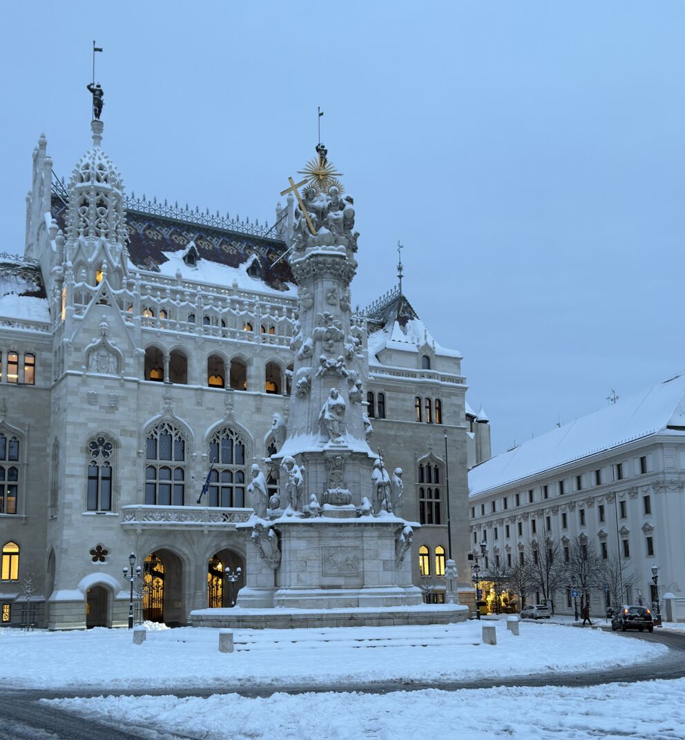 The snow-covered Holy Trinity Square in the historic Buda Castle District