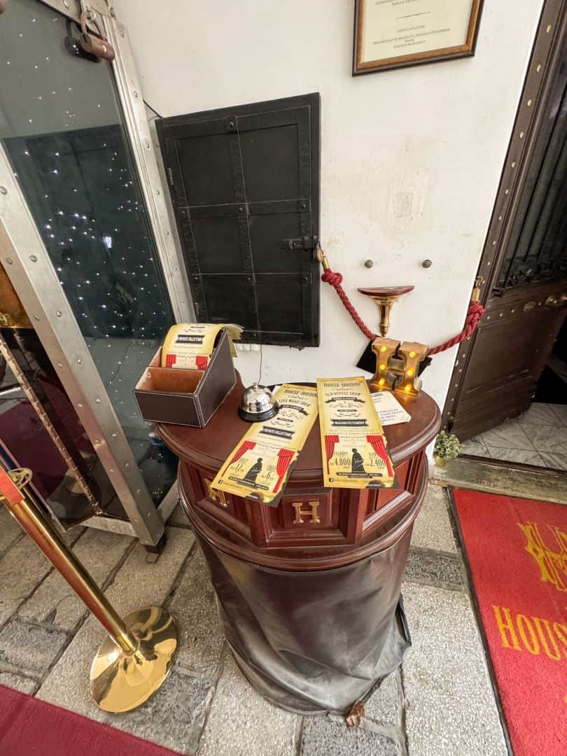 Vintage-style admission tickets for The House of Houdini