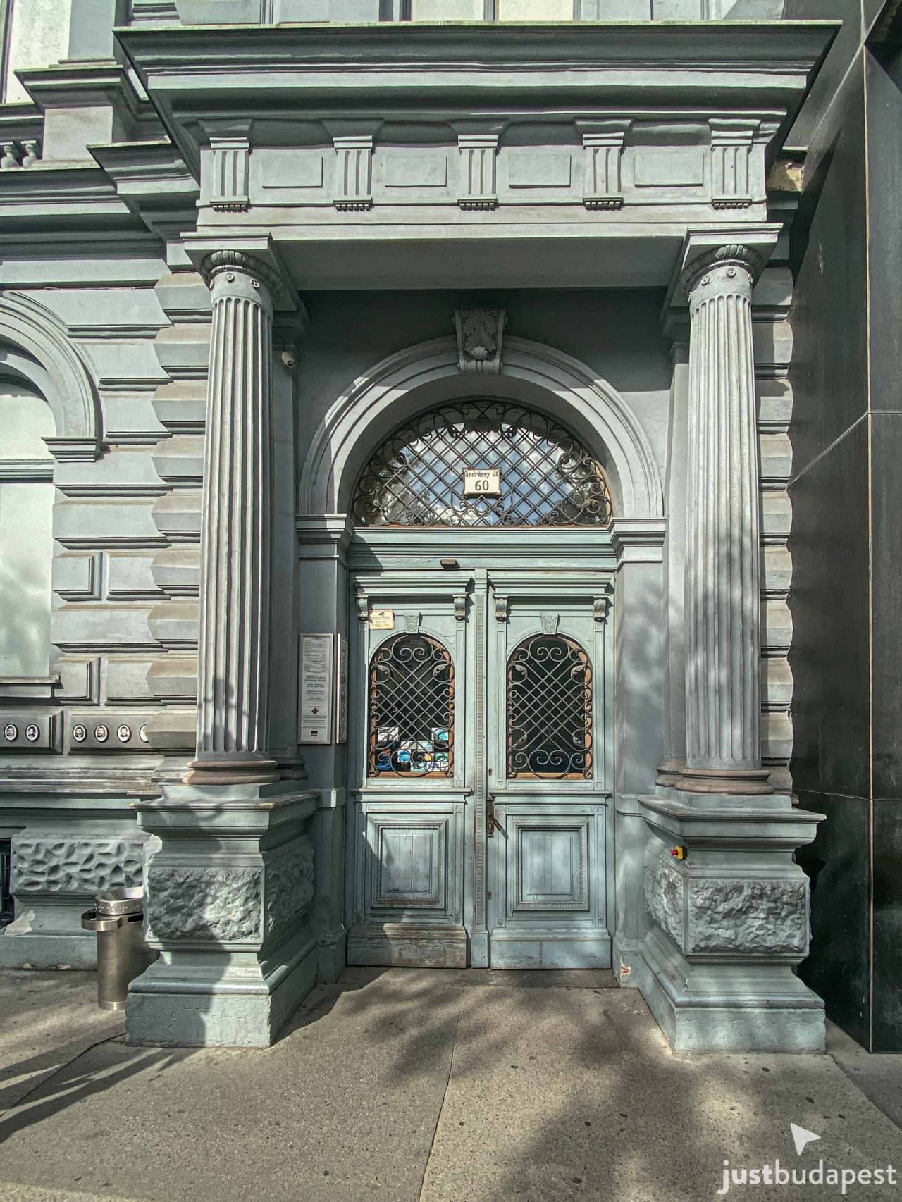 Starkly lit exhibition room showing Communist era artifacts and propaganda
