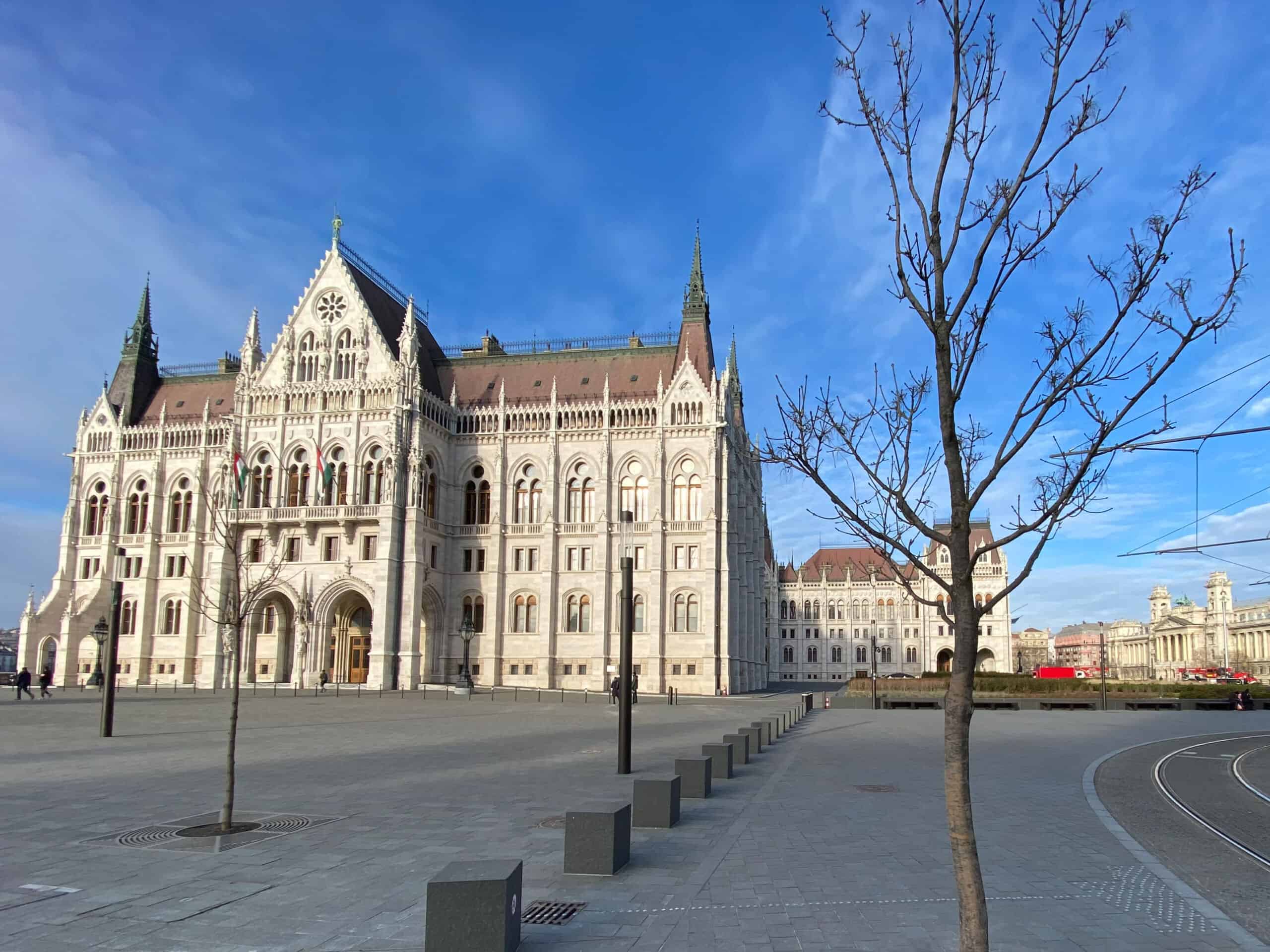 The gigantic Hungarian Parliament building beautifully covered widely in deep white winter snow