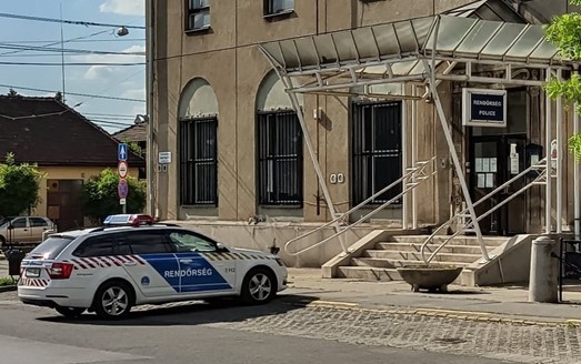 A marked Hungarian police car (Rendőrség) parked in Budapest