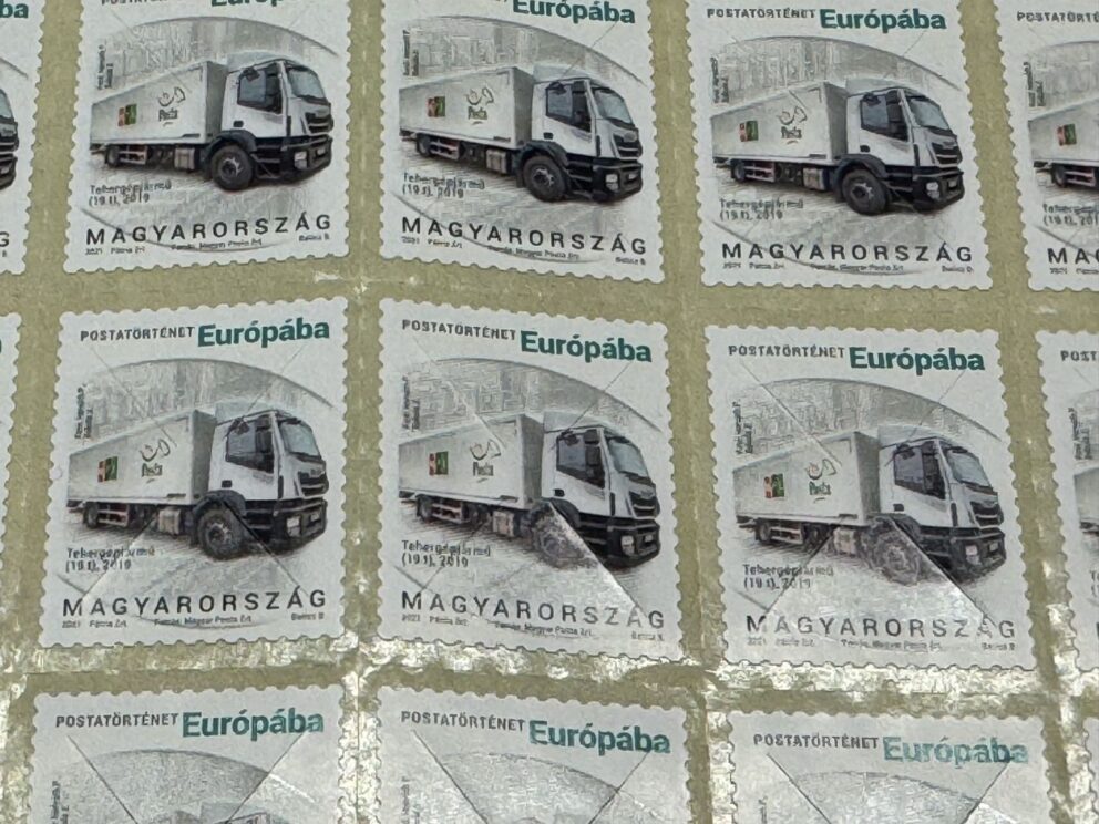 A sheet of Hungarian postal stamps for Europe featuring a delivery truck