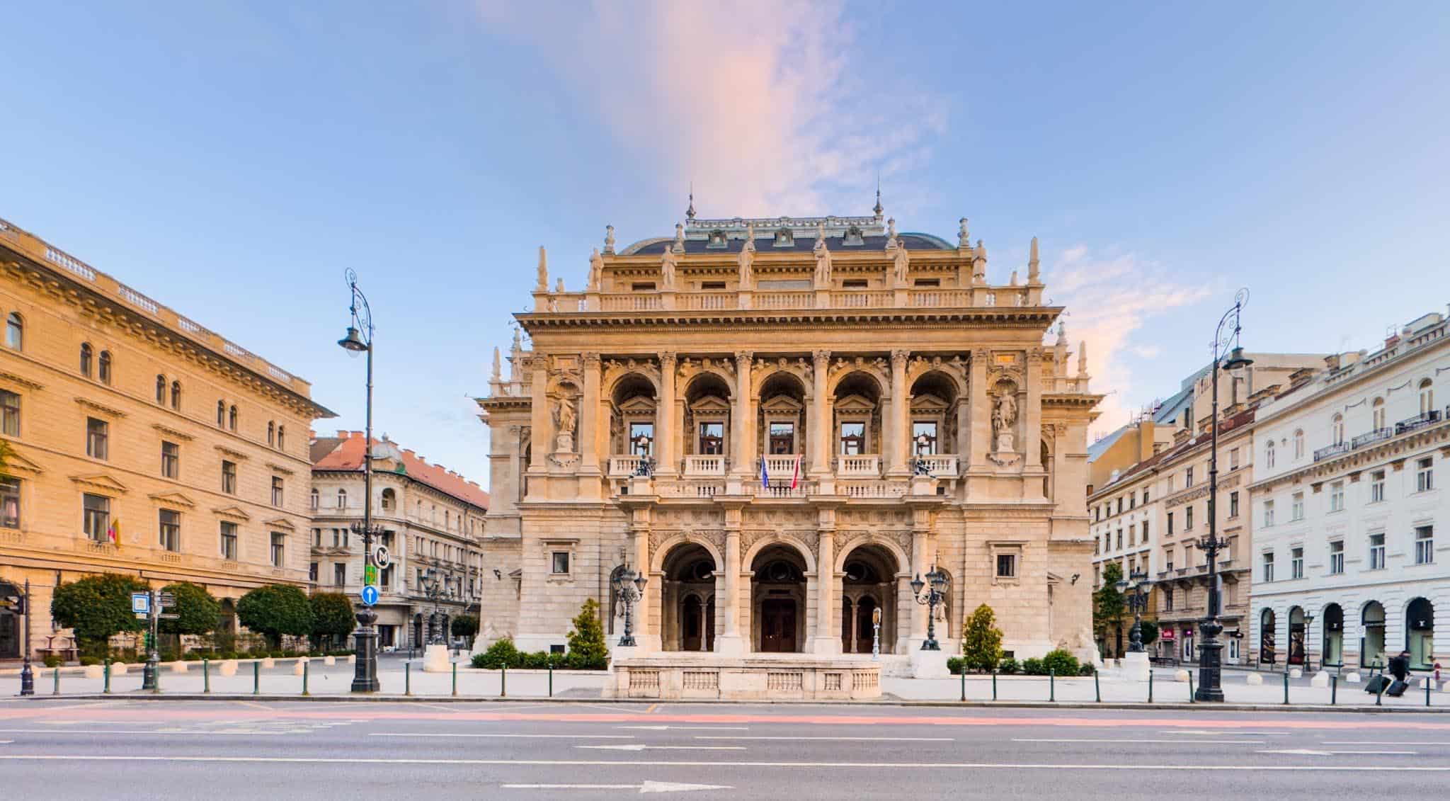 Daytime street view of the Hungarian State Opera House entrance on Andrássy Avenue