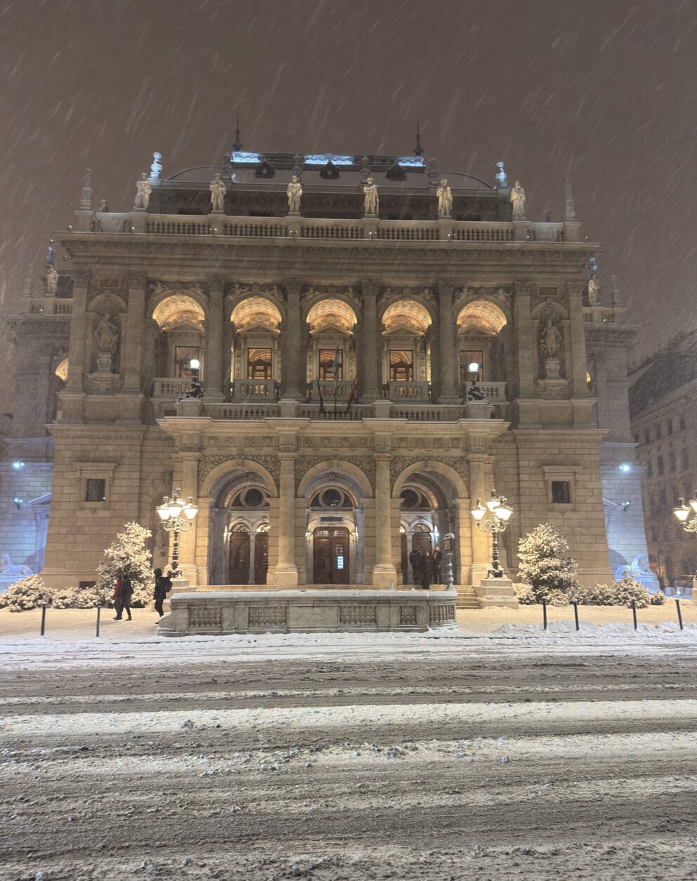 Heavy snowfall illuminating the facade of the Hungarian State Opera House