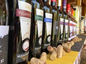 Bottles of Hungarian red wine and scattered corks
