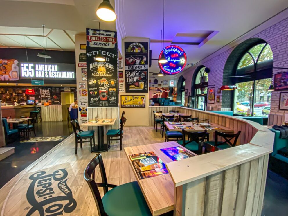 Comfortable seating and large sports screens inside the I55 American Bar