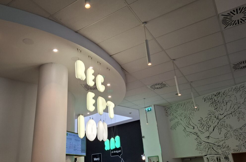 The heavily playful, brightly colored communal lobby seating area with oversized cushions