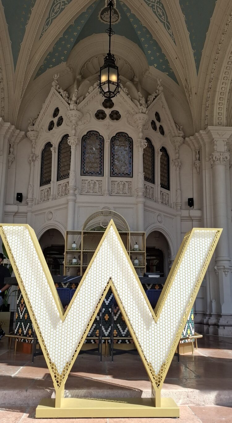The iconic illuminated W logo inside the Budapest hotel lobby