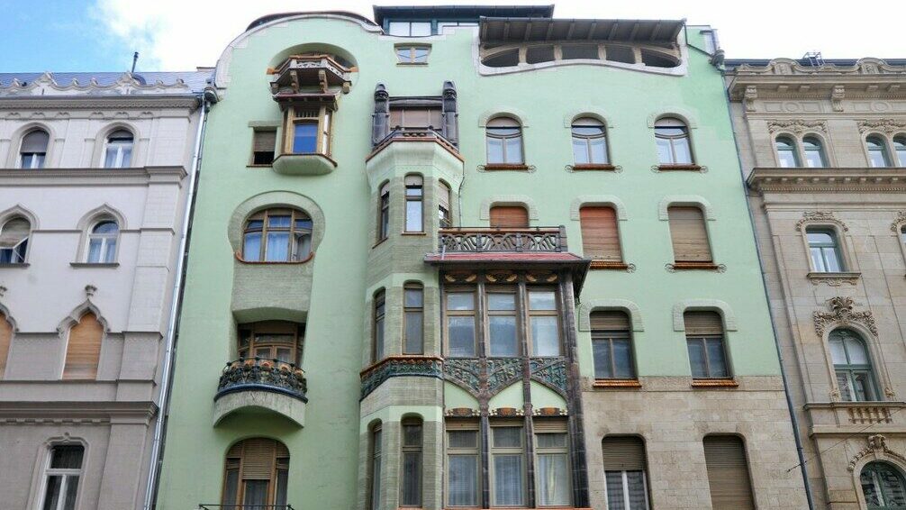 Close up of the entrance to Bedő House with detail of the art nouveau window in Budapest