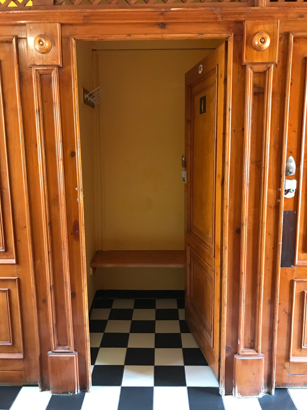 Inside a private wooden changing cabin at Széchenyi Thermal Baths