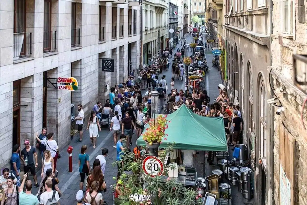 A bustling crowd on Kazinczy Street in the Jewish Quarter