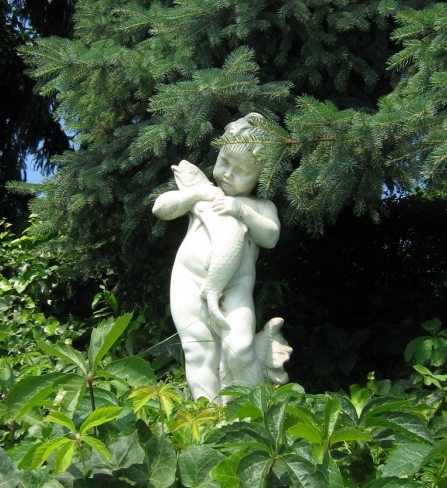 Peculiar child sculpture in the garden of Csillaghegyi thermal bath in Budapest