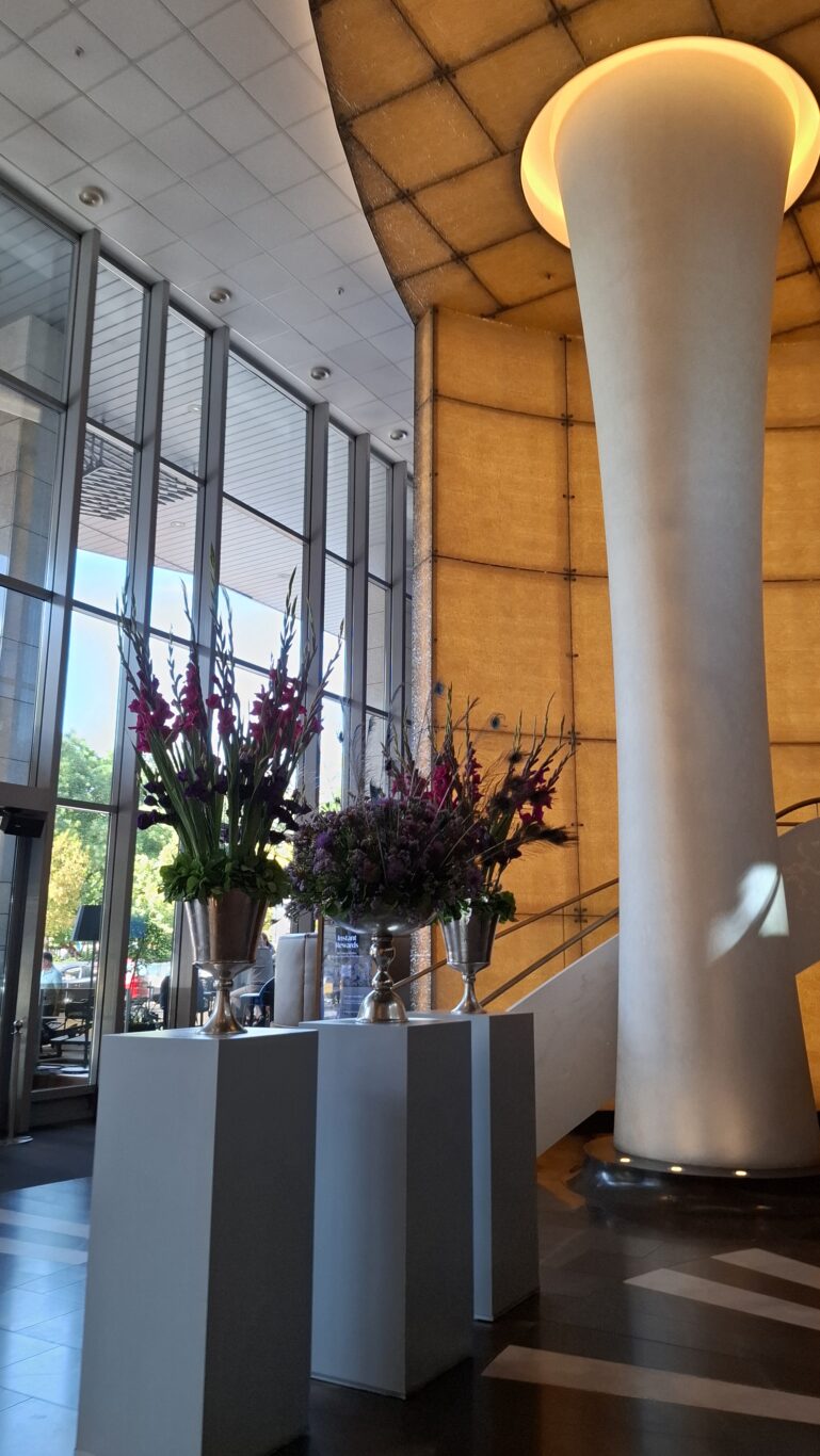 An utterly spotless guest bathroom completely wrapped entirely in heavily polished marble