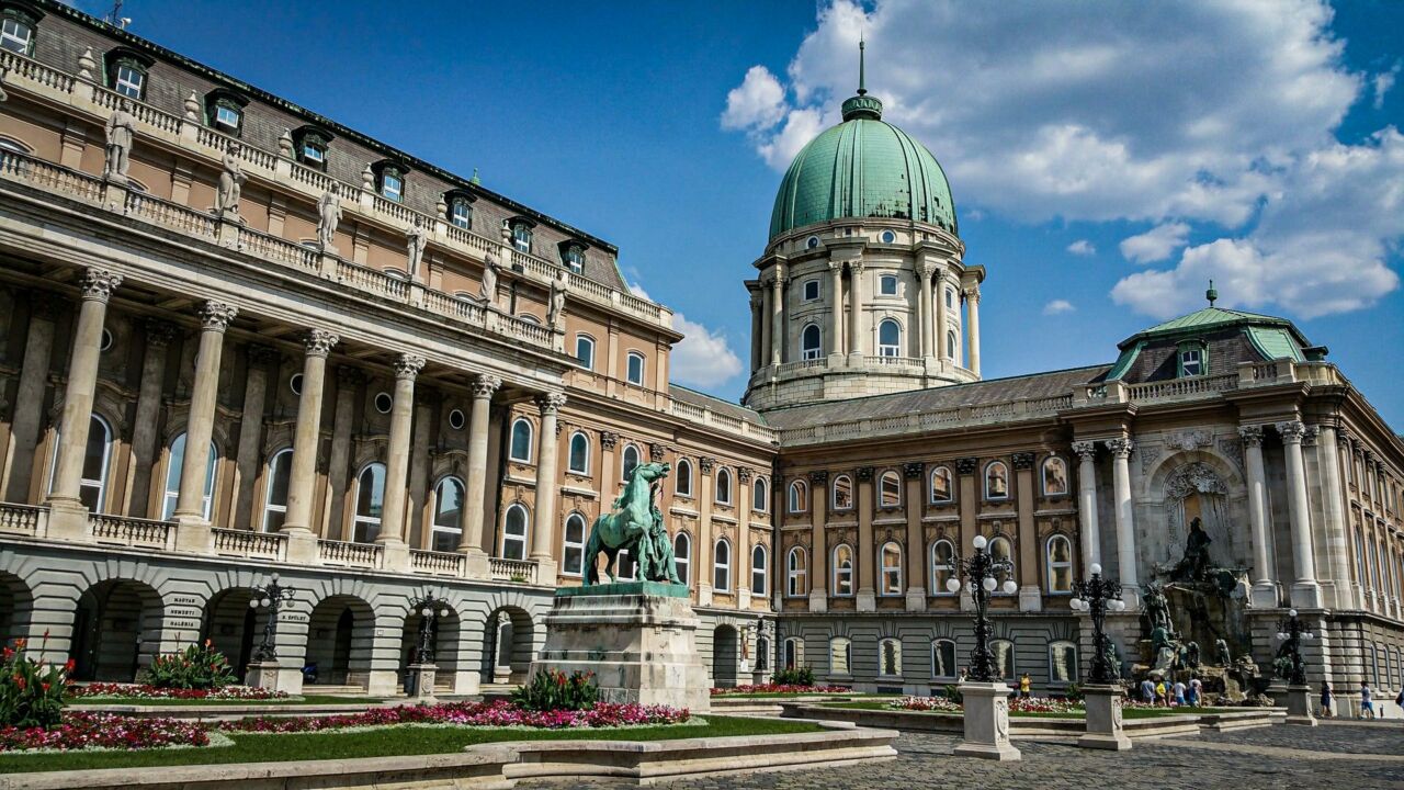 The massive green oxidized Turkish metal dome completely crowning the roof of Király Baths