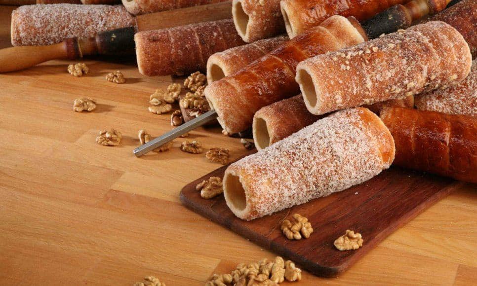 Traditional chimney cakes with sugar, walnut, and cinnamon coating
