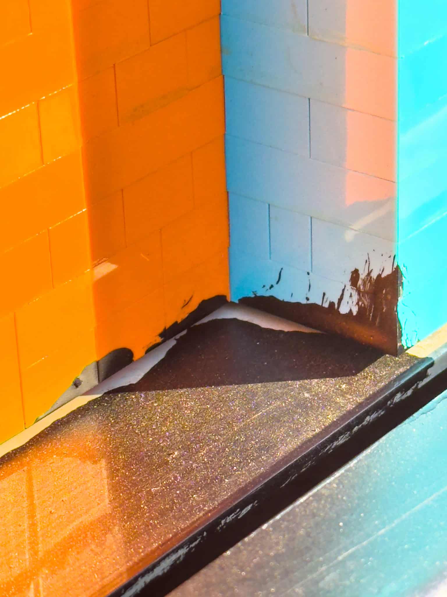 Large, blocky LEGO character figures explicitly built into the driver cabin