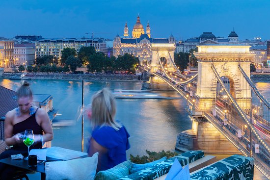 The spectacular Chain Bridge view from a table at Leo Rooftop Bar