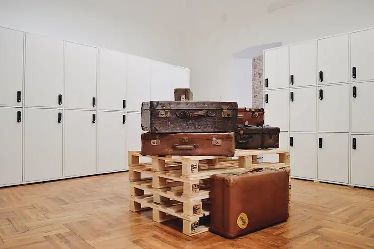 The branded wooden reception counter safely inside the Lion's Locker luggage storage cafe