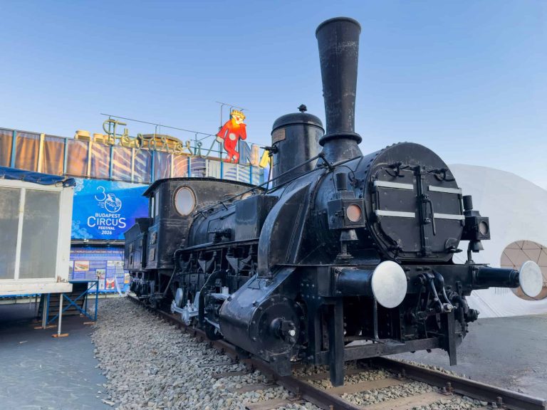 Wide shot of the locomotive 2459 display with festival banners in background