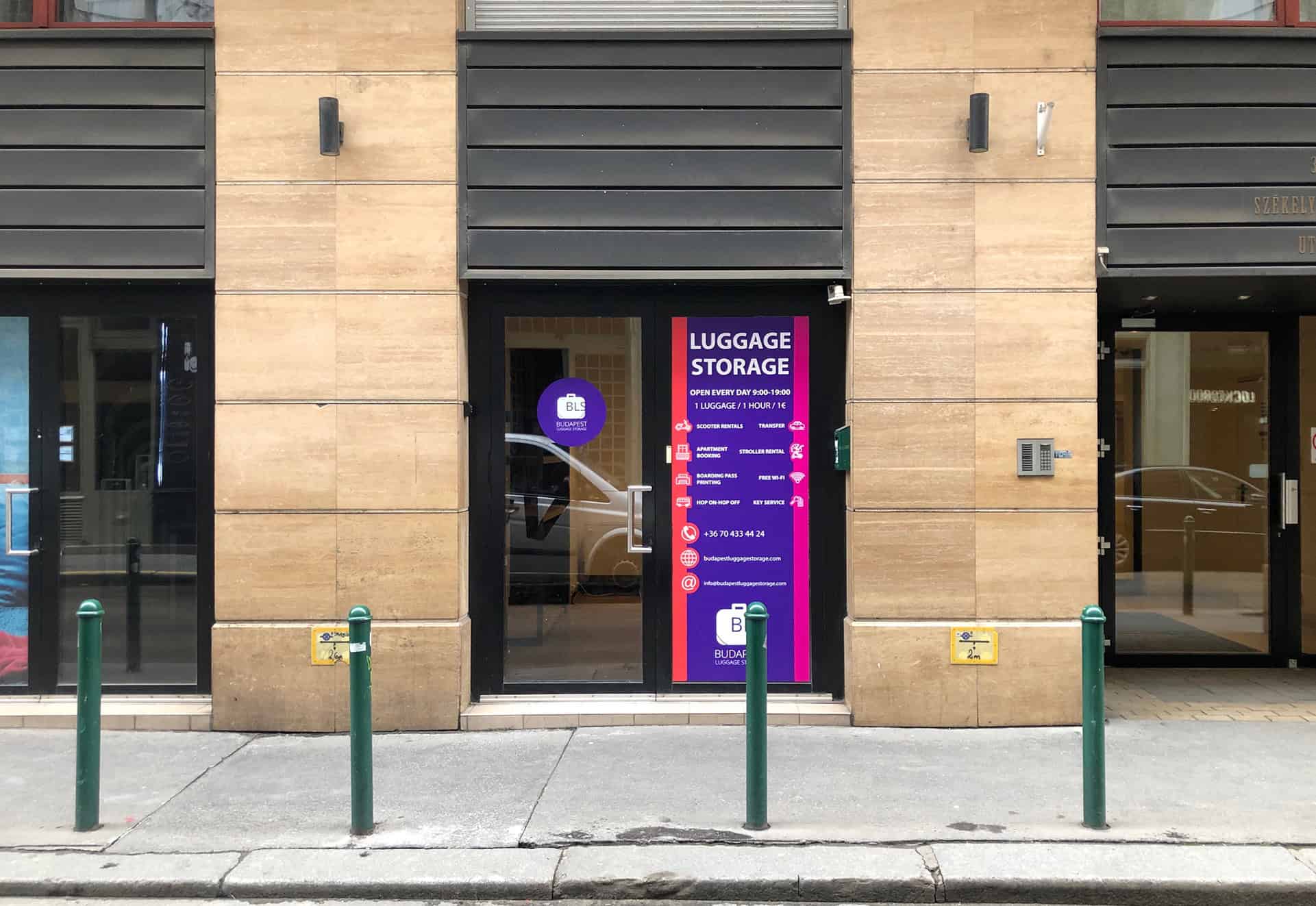 Travelers interacting firmly with a massive wall of grey coin-operated public lockers