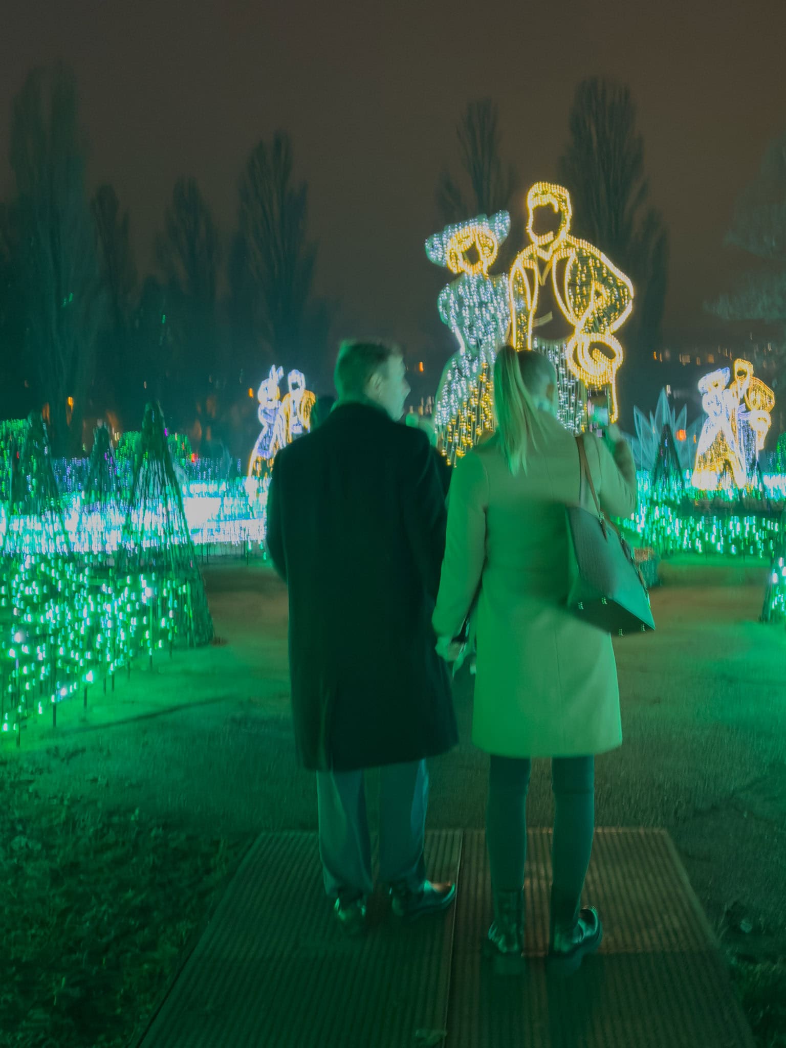 Elegant silhouetted dancers beautifully crafted from shining gold lights