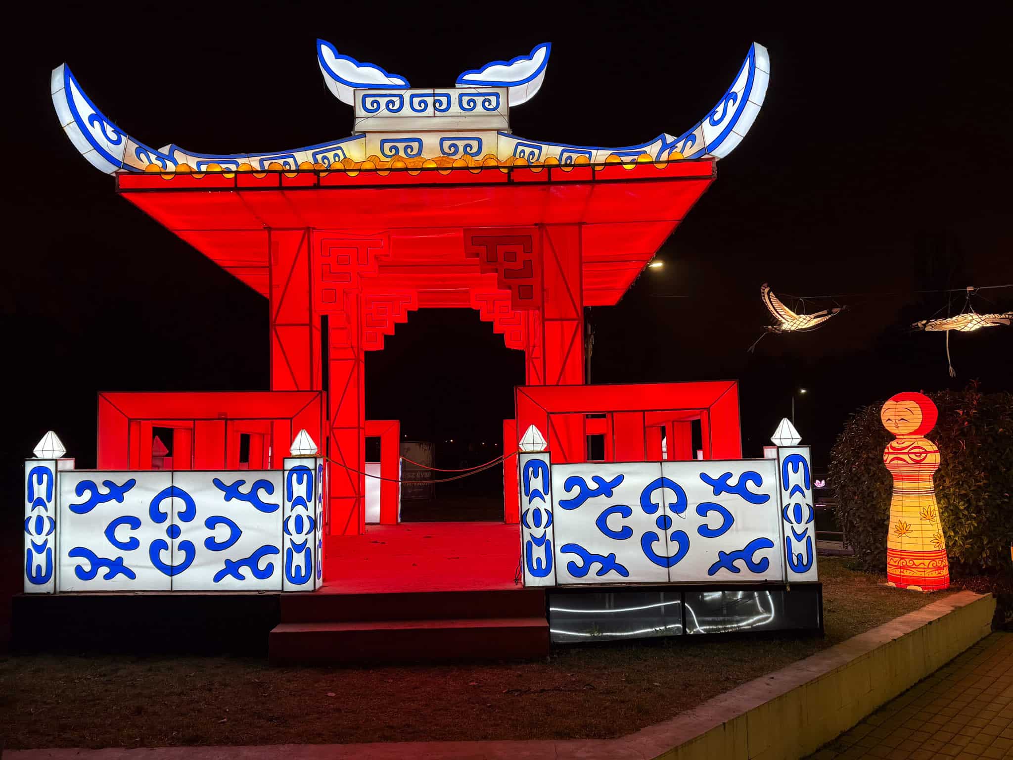 A massive brightly lit traditional Japanese Torii gate at Lumina Park