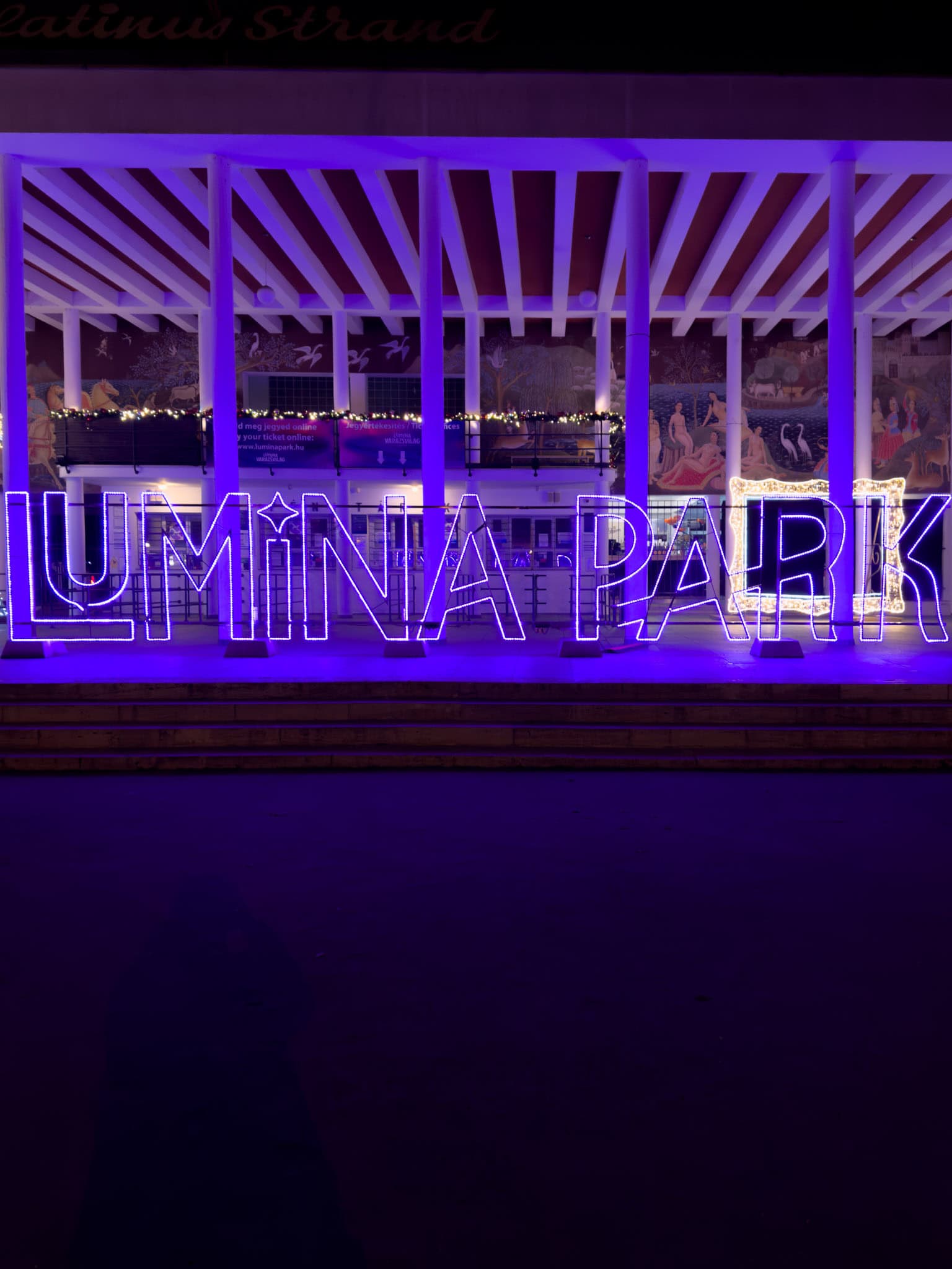 The massive brightly colored Lumina Park entrance archway welcoming excited evening visitors