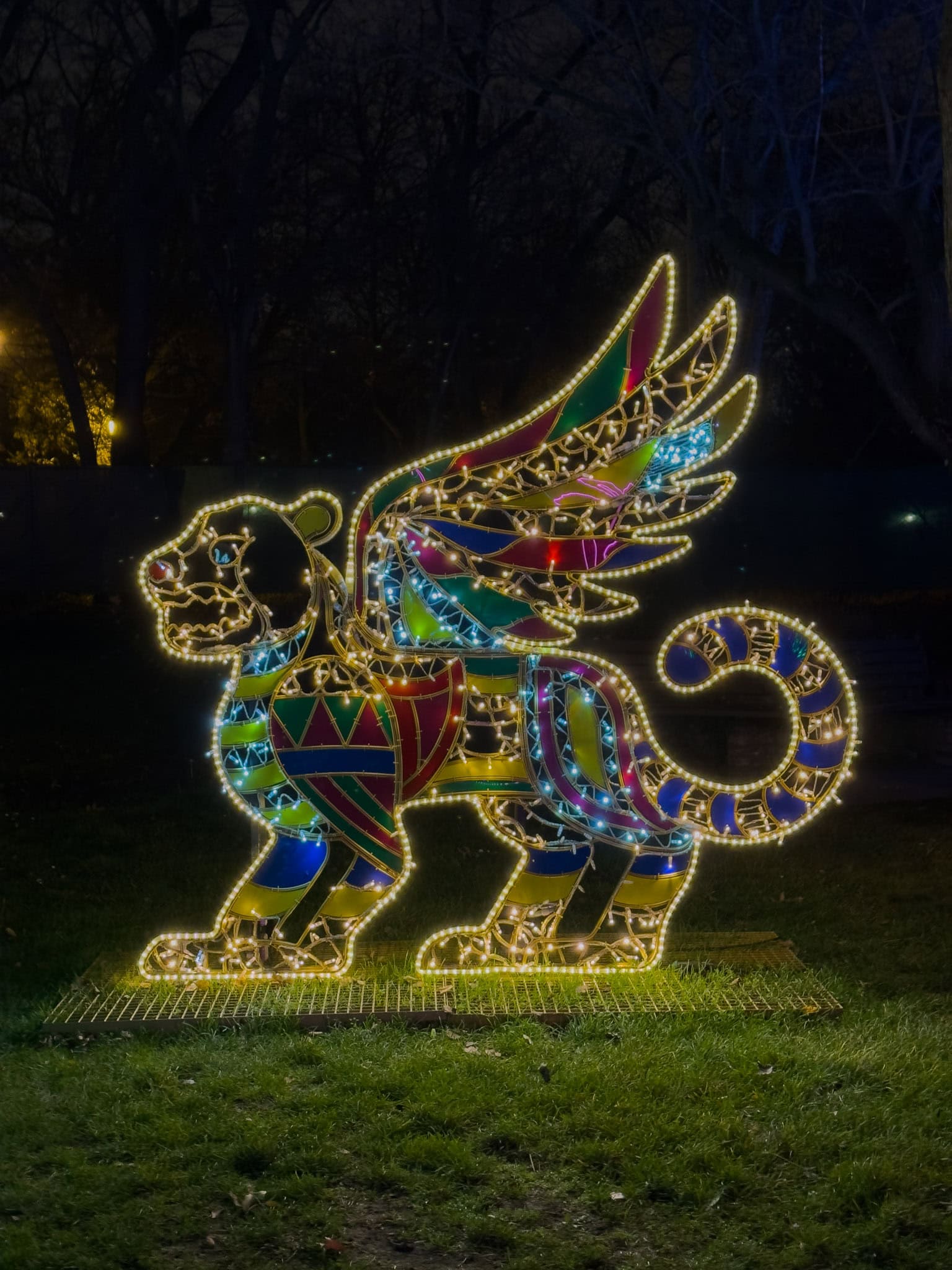 A colorful glowing mythical spirit cat clearly entirely covered in deep neon patterns